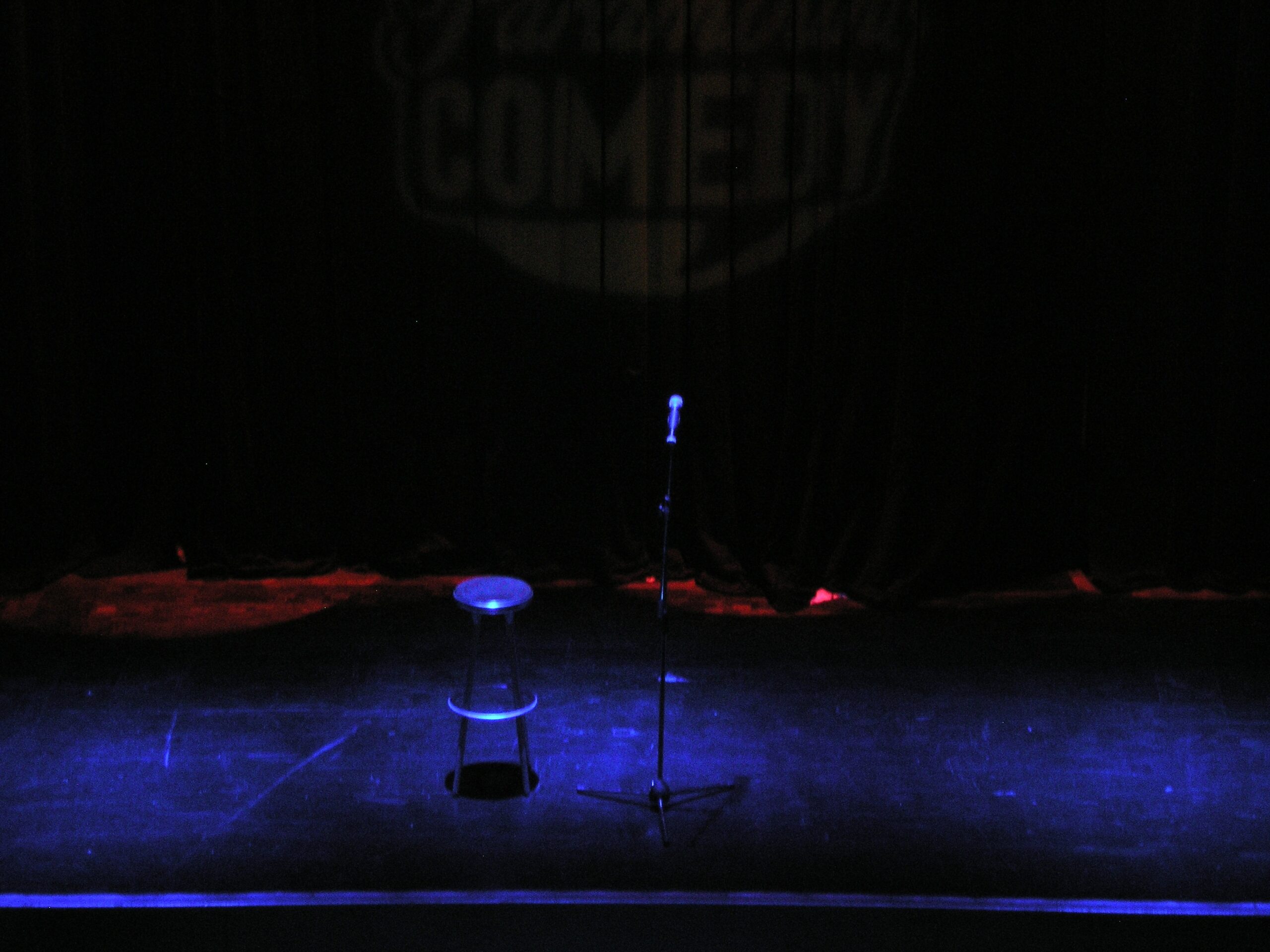 An empty stand-up comedy club stage, representative image (not the actual venue)
